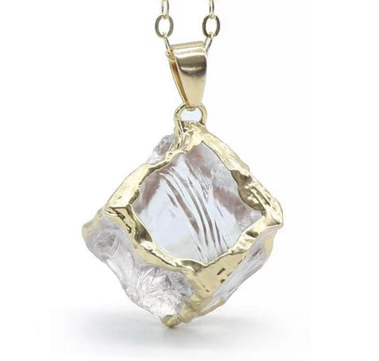 Clear quartz and gold pendant